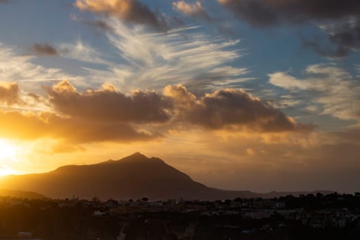 Magic sunset over Procida Island with Ischia island in the background.