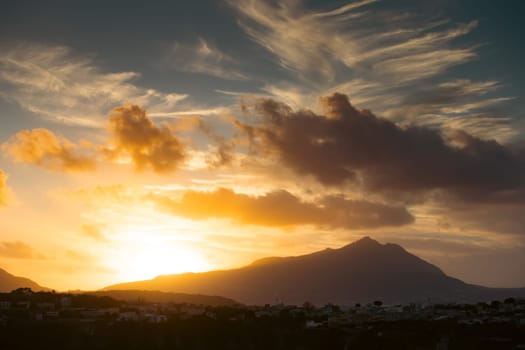 Magic sunset over Procida Island with Ischia island in the background.