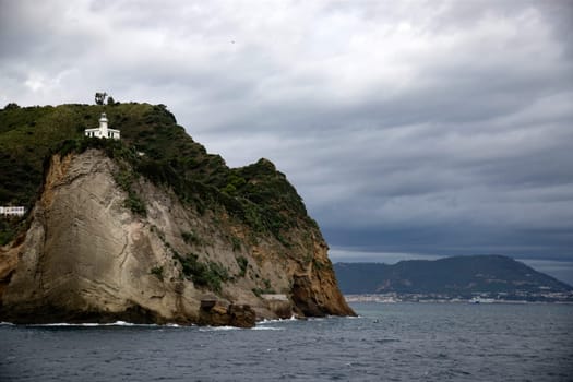 Capo Miseno and its lighthouse that marks the northwestern limit of the Gulf of Naples, Italy