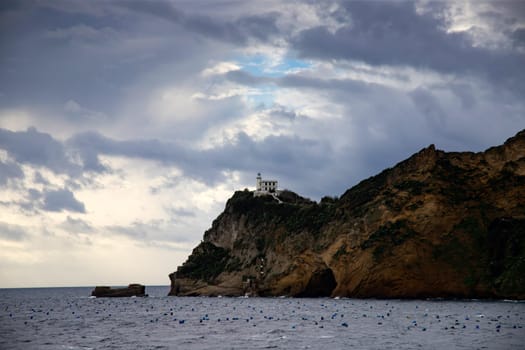 Capo Miseno and its lighthouse that marks the northwestern limit of the Gulf of Naples, Italy
