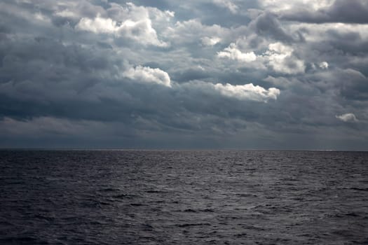 Beautiful colorful sky with approaching storm over the sea