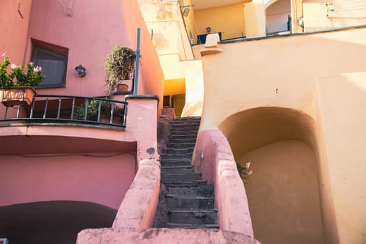 Procida island with colorful houses in small town street