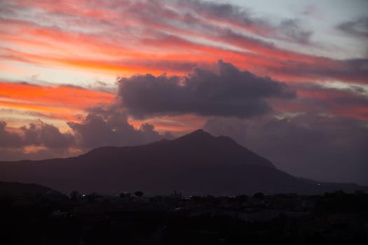 Magic sunset over Procida Island with Ischia island in the background.