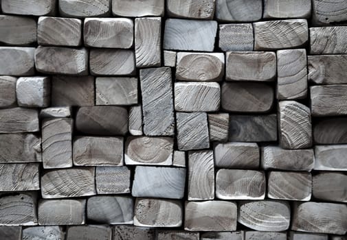 A texture of wood. Many stacked wooden slats from the front side.
