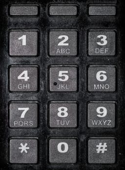 A detail of a keyboard with the numbers from 0 to 9 and the alphabet.