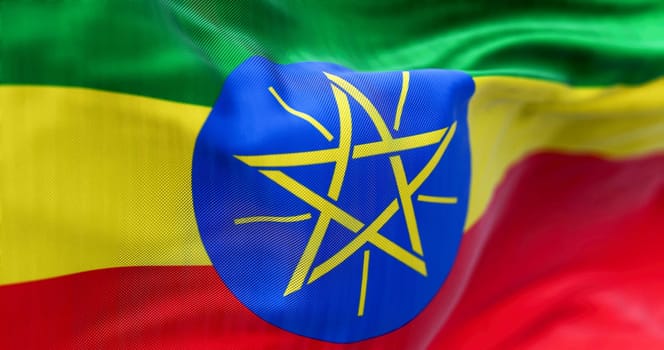 Ethiopia flag waving in the wind. The Federal Democratic Republic of Ethiopia is a state in the Horn of Africa. Rippled fabric. Textured background. Selective focus. Realistic 3d illustration render.