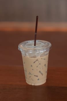 Iced coffee on wooden table, stock photo