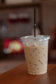 Iced coffee on wooden table, stock photo