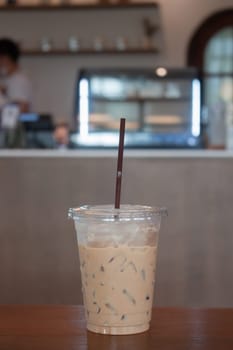 Iced coffee on wooden table, stock photo