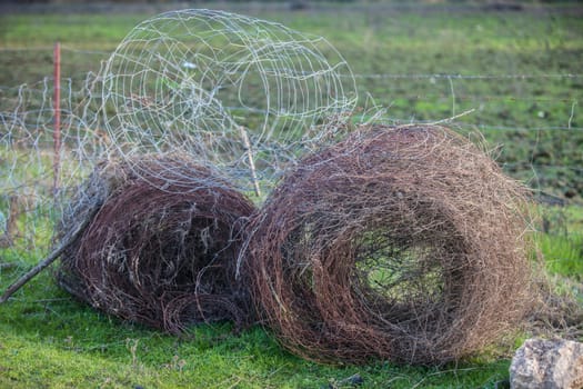 Livestock fence removed and rolled up. Country shot