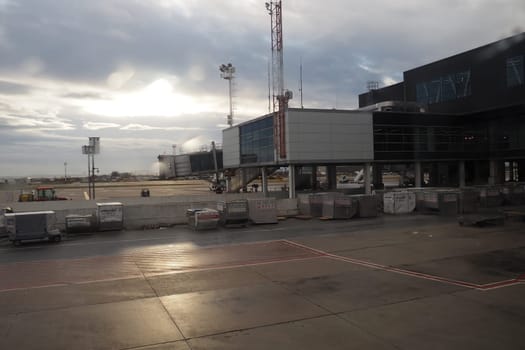 Belgrade, Serbia, January 19, 2023. Shot from the window of an aircraft moving across the airfield. Terminals and buildings of the airport Nikola Tesla in Surcin. International flights in the Balkans