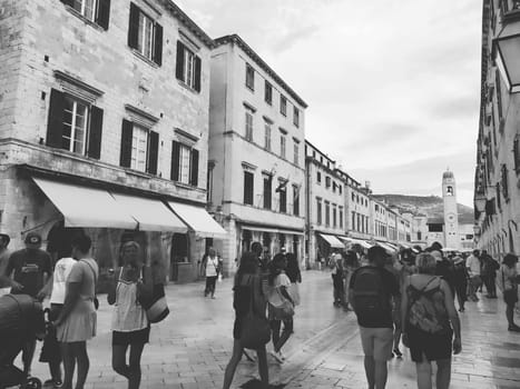 Stradun, Stradone is the main street of the historic city center of Dubrovnik in Croatia. architectural sights. A popular place for tourist walks. People are walking August 14, 2022 Black and white.