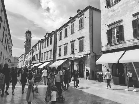 Stradun, Stradone is the main street of the historic city center of Dubrovnik in Croatia. architectural sights. A popular place for tourist walks. People are walking August 14, 2022 Black and white.