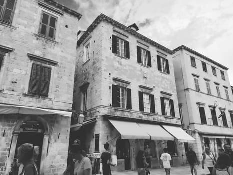 Stradun, Stradone is the main street of the historic city center of Dubrovnik in Croatia. architectural sights. A popular place for tourist walks. People are walking August 14, 2022 Black and white.