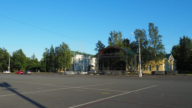 Petrozavodsk, Karelia, August 3, 2022 Kirov Square. Cars and passers-by. Children are rollerblading. Buildings of the city vocational school. Administration and depository of the Kizhi Museum-Reserve.