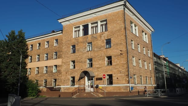 Petrozavodsk, Republic of Karelia, Russia August 3 2022 Facade of the building of the Faculty of Economics of Petrozavodsk State University. Crossing the Gylling embankment and Pravda street. Evening