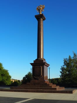 Petrozavodsk, Karelia, August 3, 2022 Monument-stele City of military glory, honorary title. Granite column with a bronze double-headed eagle. Pedestal on the alley of sister cities, Kirov Square.