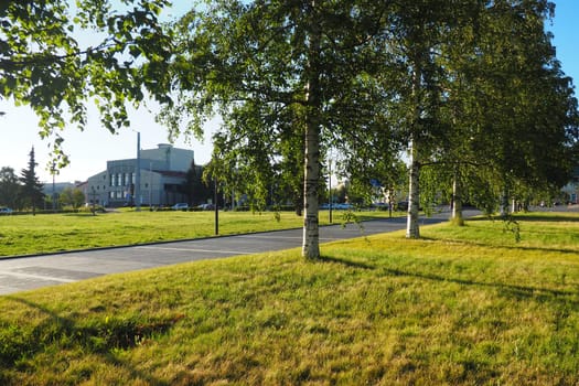 Green birches near Kirov Square Kirovan lagevo Kirovin aukio. The city center Petrozavodsk. The capital of Karelia. Venue for the main city events and celebrations August 3, 2022 Finnish theater.