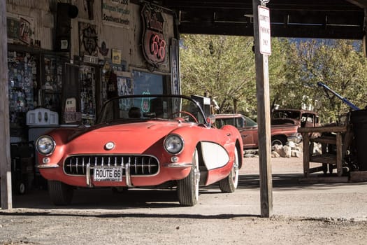 Hackberry, Arizona, United States, November 2013: old timer car fueling up in a vintage service and gas station on historic route 66