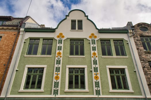 Alesund, Norway, May 2015: Vertical shot of the architecture of Kongens gate 12 in Alesund, Norway