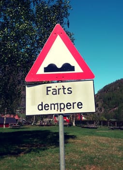 Flam, Norway, May 2015: Funny Norwegian street sign indicating bumpy road, farts dempere