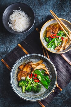 Ramen soup with mushrooms, vegetables, glass noodles and pork