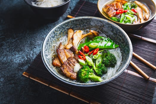 Ramen soup with mushrooms, vegetables, glass noodles and pork