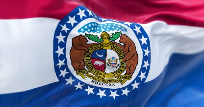 The US state flag of Missouri waving in the wind. Missouri is a state in the Midwestern region of the United States. Rippled fabric. Textured background. Realistic 3d illustration. Close-up