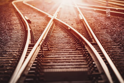 View of the crossing railway in sunset in summer. Concept of logistic and transportation.