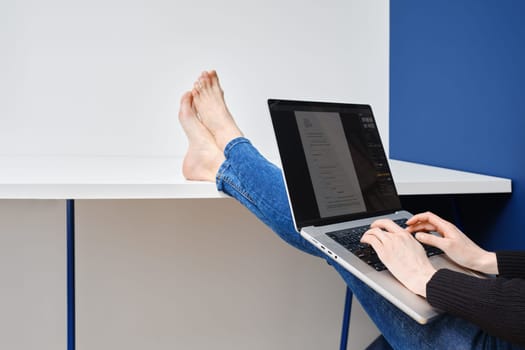 Unrecognizable woman fills out tax declaration form online