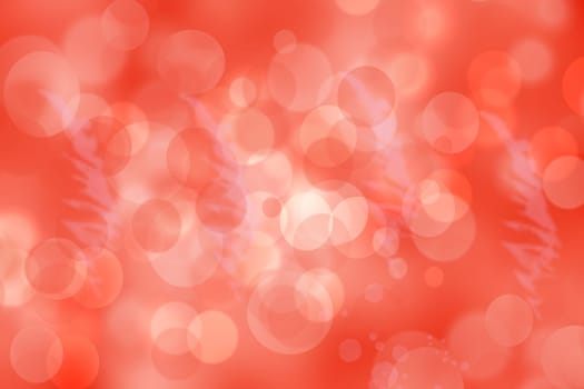 A festive abstract gradient orange pink red background texture with glitter defocused sparkle bokeh circles . Card concept for Happy New Year, party invitation, valentine or other holidays.