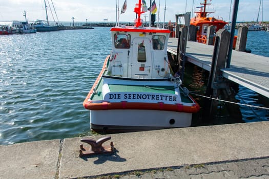 Harbour in Timmendorf Strand, Germany, September 9, 2022 - Sea rescue boat in the harbour, Germany at Timmendorf Strand, on the island of Poel, Mecklenburg-West Pomerania