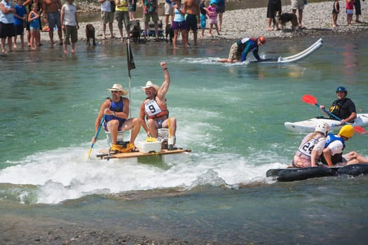 People having fun in the Uncompahgre River water festival in Ridgeway, Colorado.
