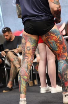 Krakow, Poland - June 12, 2022: Unidentified participant during the contest for the best tattoo at the 15th Tattoofest Convention in Cracow. One of the most prestigious tattoo festivals.