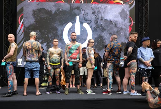 Krakow, Poland - June 12, 2022: Unidentified participants during the contest for the best tattoo at the 15th Tattoofest Convention in Cracow. One of the most prestigious tattoo festivals.