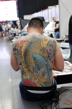 Krakow, Poland -  June 12, 2022: Unidentified  participant at 15th Tattoofest Convention in Cracow. One of the most prestigious tattoo festivals.