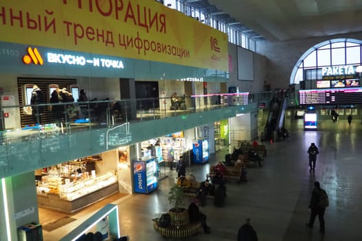 Moscow, Russia 20.01.2023 Leningradsky railway station. The passenger terminal of the Moscow-Passenger railway station on Komsomolskaya Square. Shops and cafes, people hurrying, waiting for the train.
