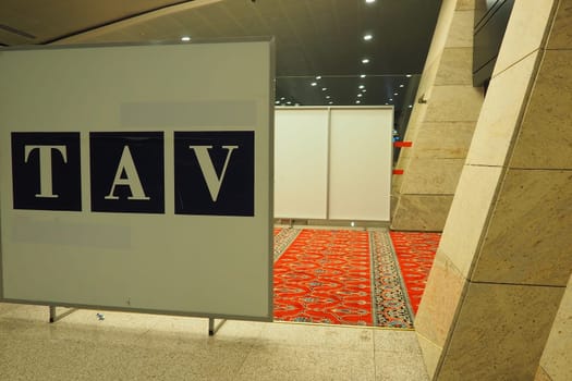 Ankara, Turkiye, Esenboga Havalimani Airport, 01.18.2023 Empty prayer hall at night. Namaz or salat is a prayer in Islam. Isha prayer. Red prayer carpet. Nobody at night. Sajjada, namazlik, jai-namaz.