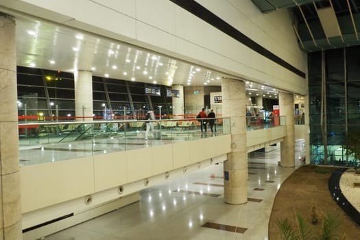 Ankara, Turkiye, Esenboga Havalimani Airport, 01.18.2023 lobby or corridor at the airport for the transit of passengers who have passed check-in. Airport interior. Shops, cafes and trees. Turkey.