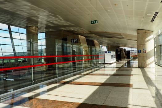 Ankara, Turkey, Esenboga Havalimani Airport, 01/18/2023 lobby or corridor at the airport for the transit of passengers who have passed screening. Airport interior. Glass windows and sunlight. Turkiye