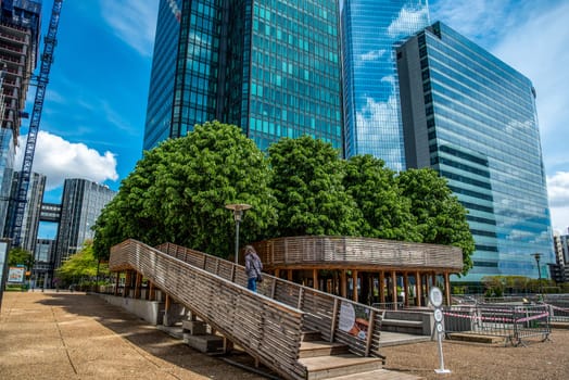 Modern Installation of a path in the trees between skyscrapers in La Defense financial district in Paris, France