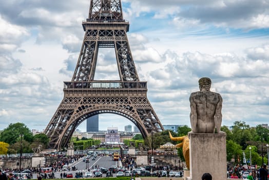 View of the Eiffel Tower from Trocadero Garden, a stone Sculpture of the Garden in the foreground, Paris, France