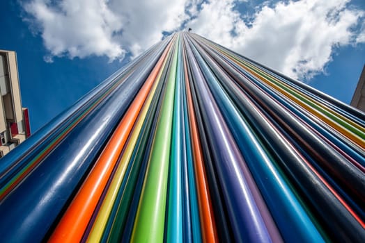 Artistic Installation of Rainbow colored Tubes in La Defense District in Paris France