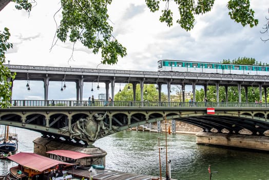 A metro crossing the bridge Bir Hakeim over the Seine in Paris, France