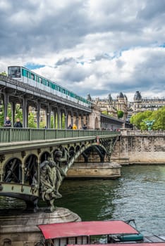A metro crossing the bridge Bir Hakeim over the Seine in Paris, France