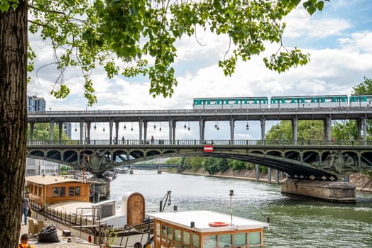 A metro crossing the bridge Bir Hakeim over the Seine in Paris, France