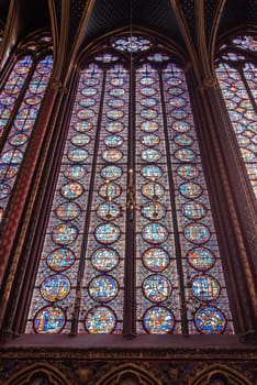 The inside of the famous Sainte Chapelle in Paris with impressing colorful windows, France