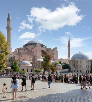 Istanbul, Turkey - August 30 2022: Long queue of tourists and locals waiting to enter Hagia Sophia Mosque, or Ayasofya Camii, formerly a Greek Orthodox church, during Victory Day holiday