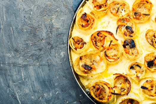 Vegetables baked with cheese in pita bread. Casserole in a pan. Space for text