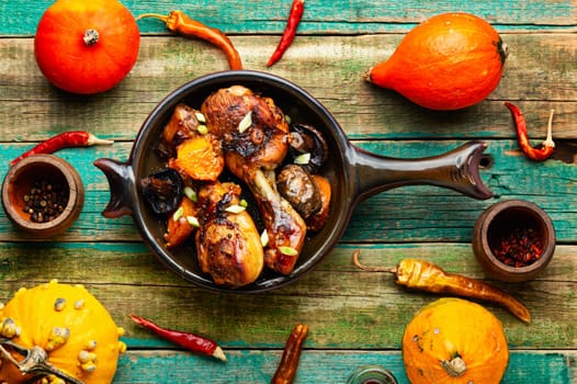 Grilled chicken thigh with vegetables for Thanksgiving Day. Autumnal recipe.